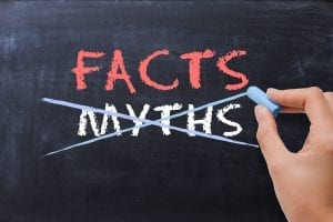 Facts and myths written on a chalk board - myths crossed out