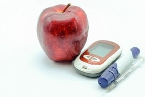 apple and diabetic insulin syringe for blood sugar
